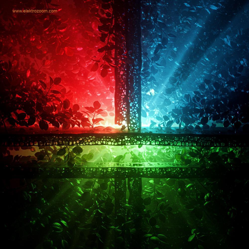 Yoğun bir yaprak örtüsünden farklı ışık renklerinin nüfuz etmesini temsil eden kavramsal bir görüntü. Kırmızı ve mavi ışıklar üst katmanlarda emilirken, yeşil ışık ışınlarının yaprak yapısının derinliklerine ulaştığı görülüyor.